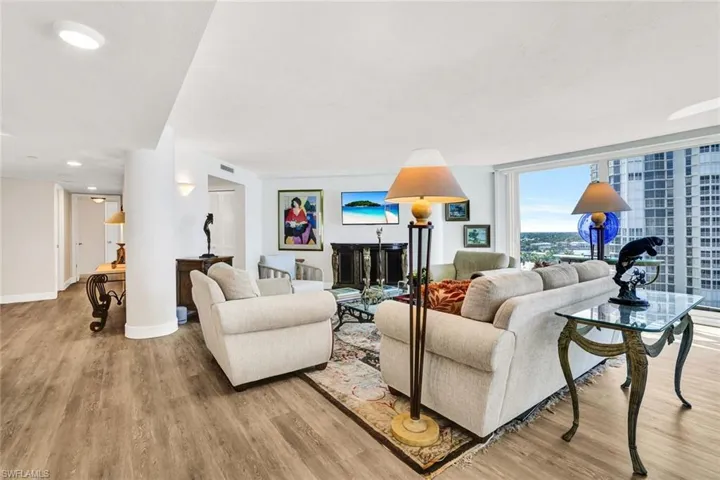 Living room featuring light wood-type flooring and baseboards