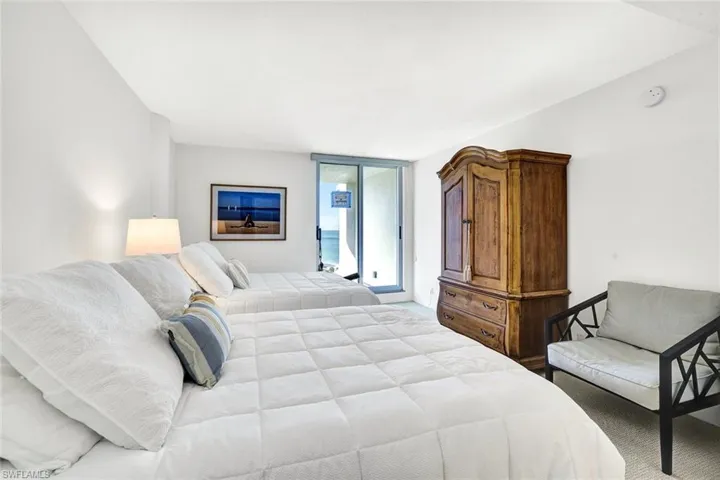 Carpeted bedroom with access to outside