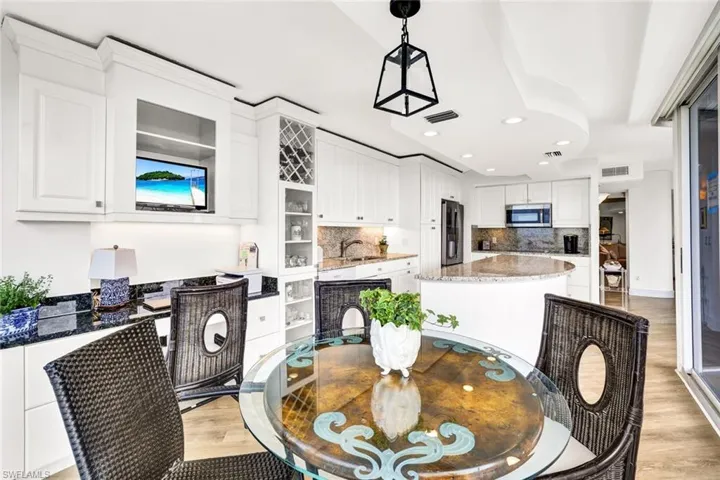 Dining space featuring recessed lighting, light wood-style floors, and visible vents