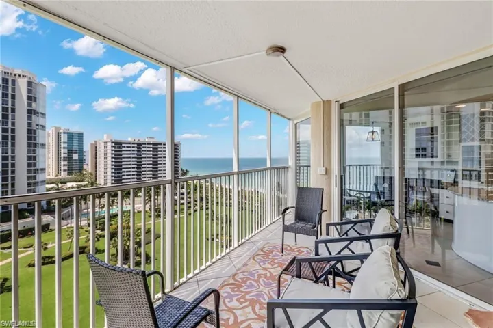 Sunroom featuring a water view