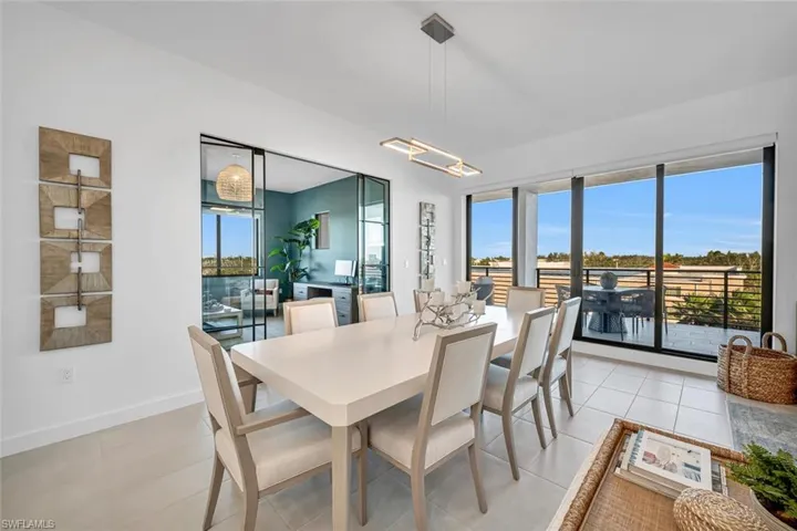 Dining area featuring light tile patterned floors