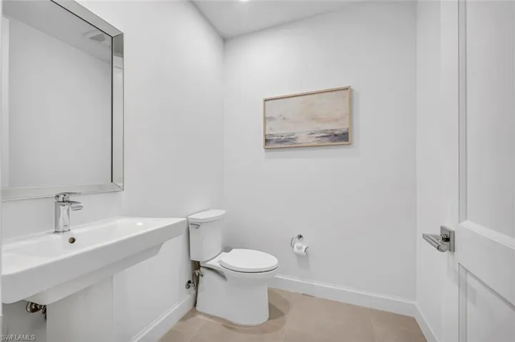 Bathroom with tile patterned flooring and toilet