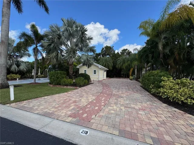 View of side of property featuring a yard