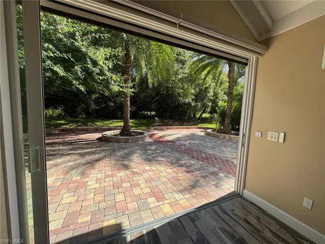 Doorway featuring wood-type flooring