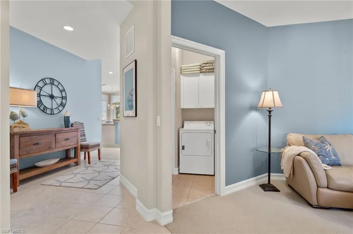 Family room is adjacent to a welcoming foyer and the laundry room.