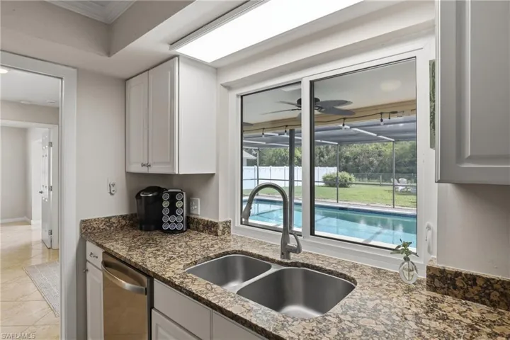 Impact "Pass-Through" Window from Kitchen to Lanai/Pool Area.