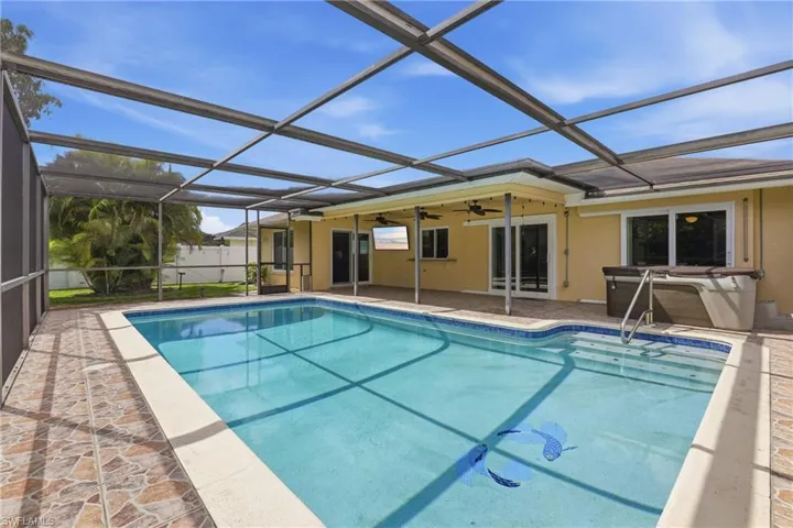 Heated Pool, Enclosed Lanai Space, Hot Tub, Sliders, & Kitchen Pass-Through Window.