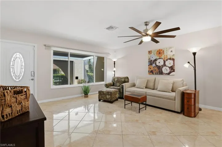 Living/Dining Area with Front Entrance & Front Window.