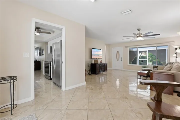 View of Dining Area, Kitchen through doorway, Living Room, & Entrance.