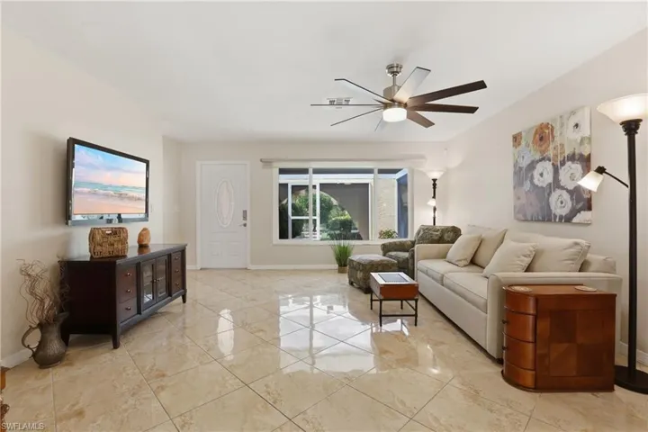 Living/Dining Room & Front Entrance. View from Rear Lanai Slider.