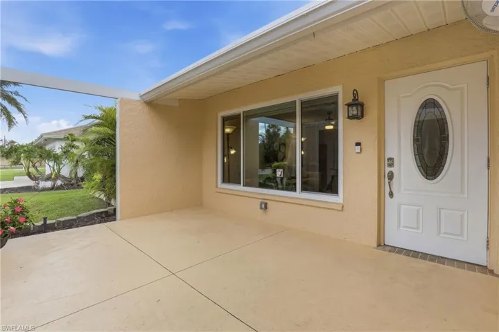 Screened, Enclosed Front Lanai of Home.