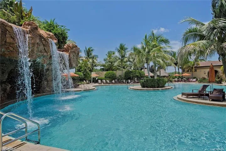 Community pool with a patio