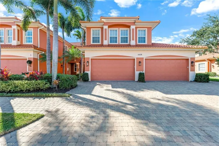 Mediterranean / spanish-style home featuring decorative driveway, stucco siding, a tiled roof, and a garage