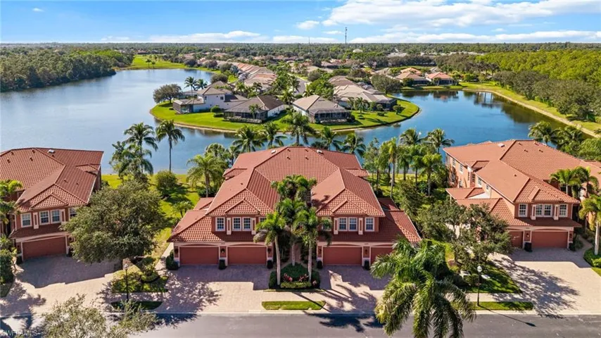 Aerial perspective of suburban area with a nearby body of water