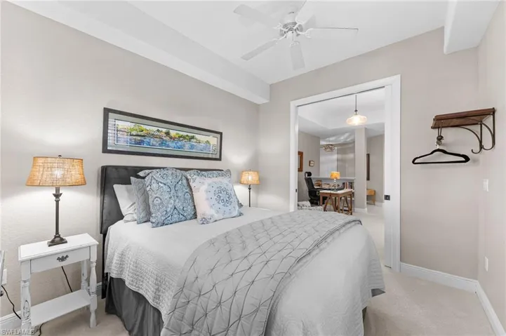 Bedroom with light carpet and ceiling fan