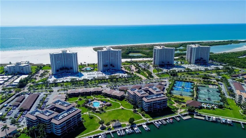 Bird's eye view featuring a water view and a view of the beach