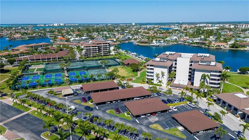 Birds eye view of property with a water view