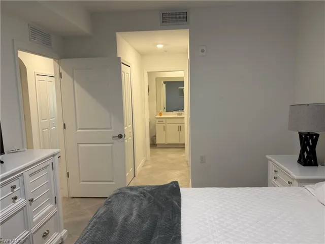 Interior room featuring neutral wall finishes, tile flooring, and multi-panel interior doors