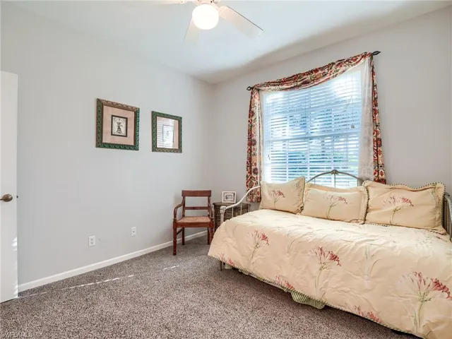 Bedroom with carpet flooring and ceiling fan