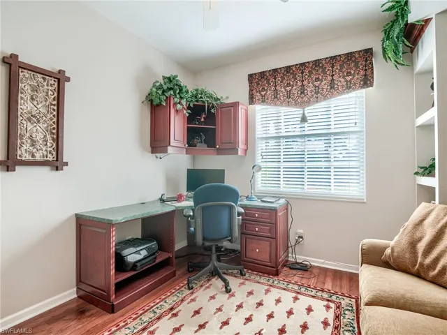 Office with wood-type flooring