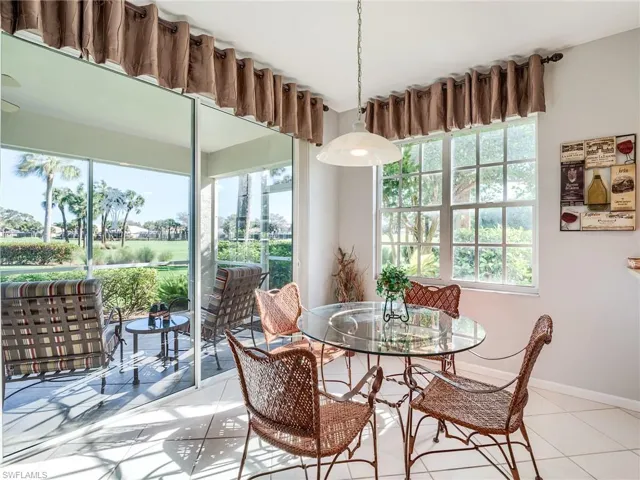 Tiled dining room with a wealth of natural light