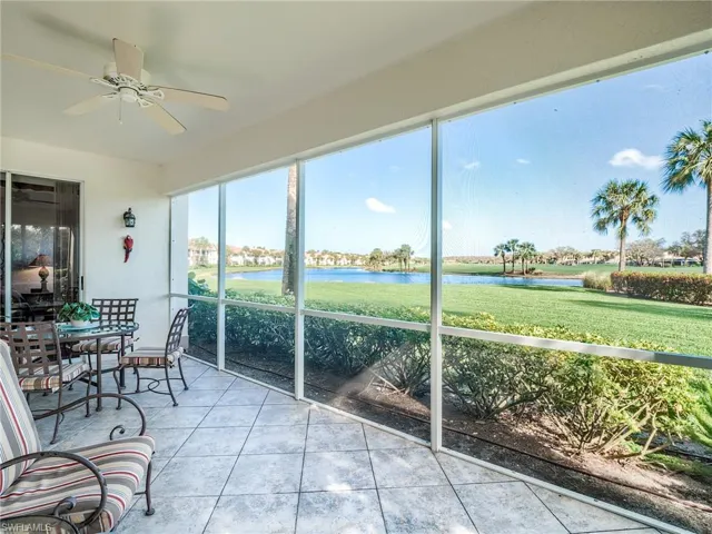Sunroom with a water view and ceiling fan