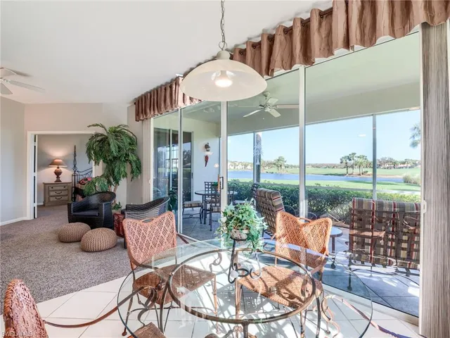 Dining room featuring ceiling fan and light tile patterned floors