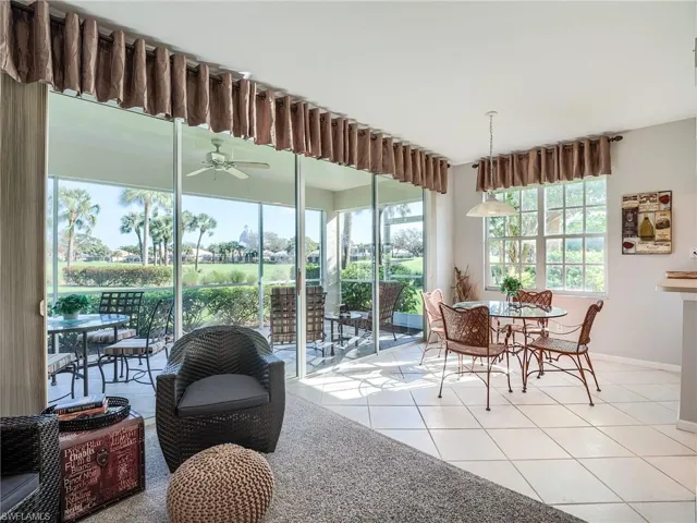 Tiled dining space with ceiling fan