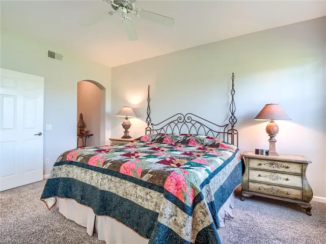 Bedroom with carpet and ceiling fan