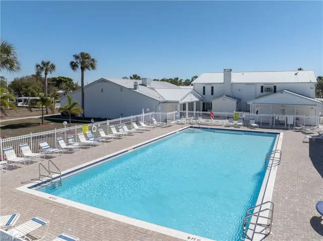 Community pool with a patio
