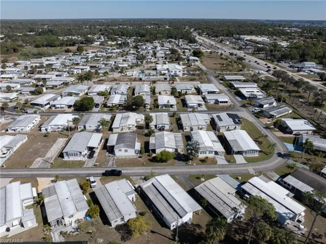 Aerial overview of property's location featuring nearby suburban area