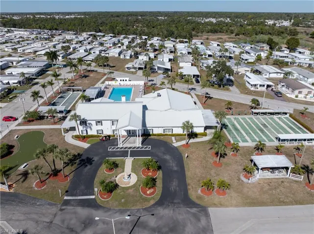 Aerial perspective of suburban area featuring a pool area