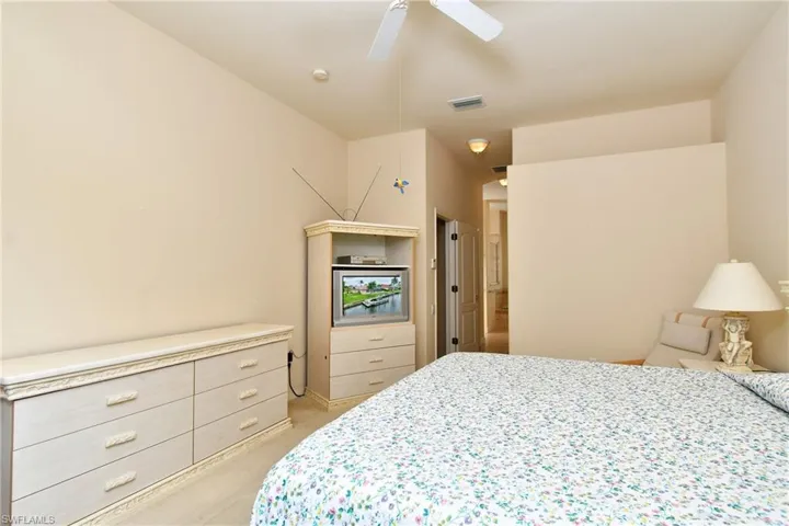 Recessed ceiling lights illuminate the space, complemented by a ceiling fan