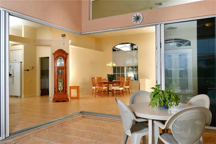 Expansive patio featuring terra cotta tile flooring