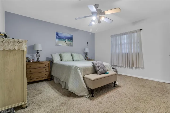 Soft gray accent wall complementing light neutral walls