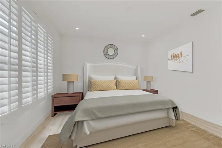 Bedroom featuring light wood finished floors and recessed lighting