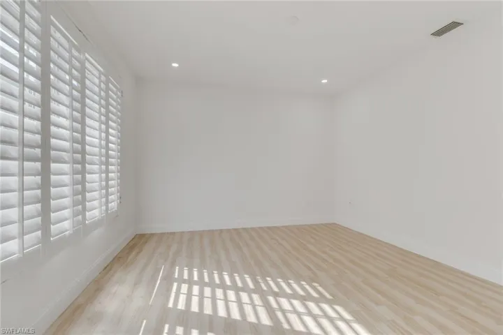 Unfurnished room featuring light wood-style flooring and recessed lighting