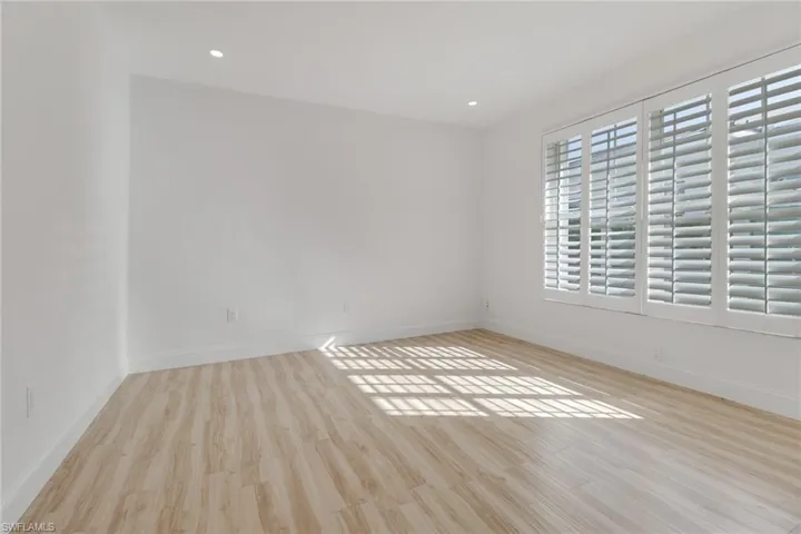Spare room with light wood-type flooring and recessed lighting