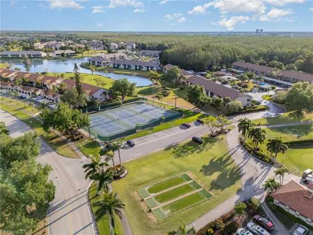 Aerial view featuring a residential view and a water view