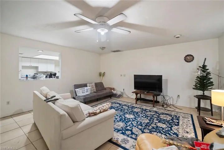 Tiled living room with ceiling fan