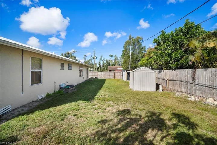 View of yard with a shed