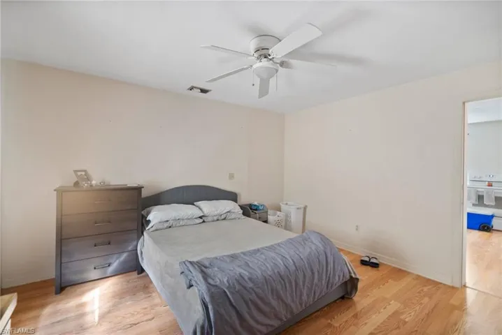 Bedroom featuring light hardwood / wood-style flooring and ceiling fan