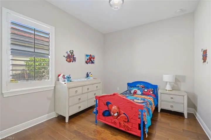 Bedroom featuring dark wood-type flooring