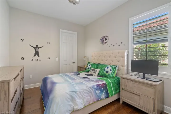 Bedroom featuring dark wood-type flooring
