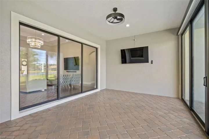 Unfurnished sunroom with a notable chandelier