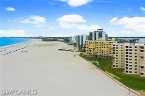 Water view with local beach and nearby urban area