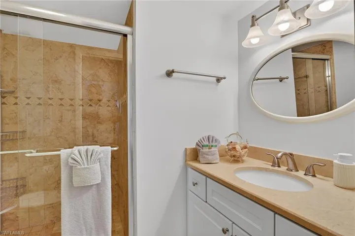 Guest bathroom with a shower stall and vanity