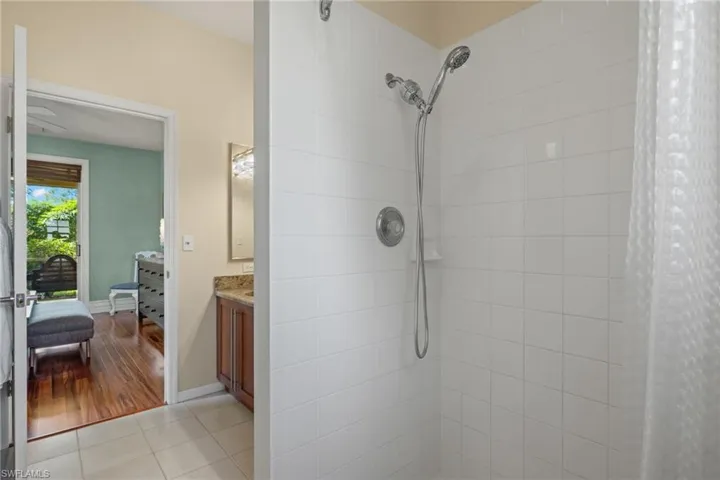 Bathroom featuring vanity, a shower with curtain, and hardwood / wood-style floors