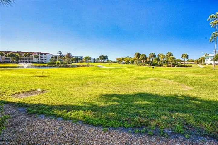 View of community featuring a yard