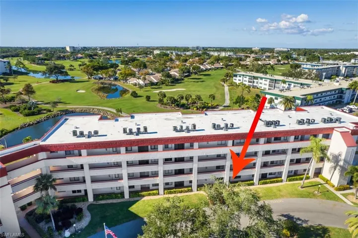 Aerial view of a golf club and a nearby body of water